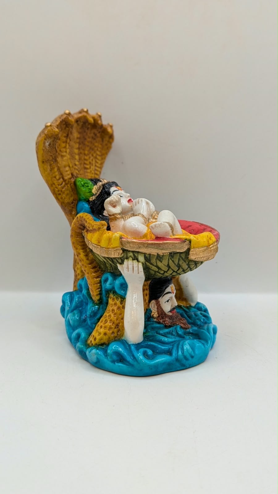 Vasudev carrying baby Krishna statue, side view