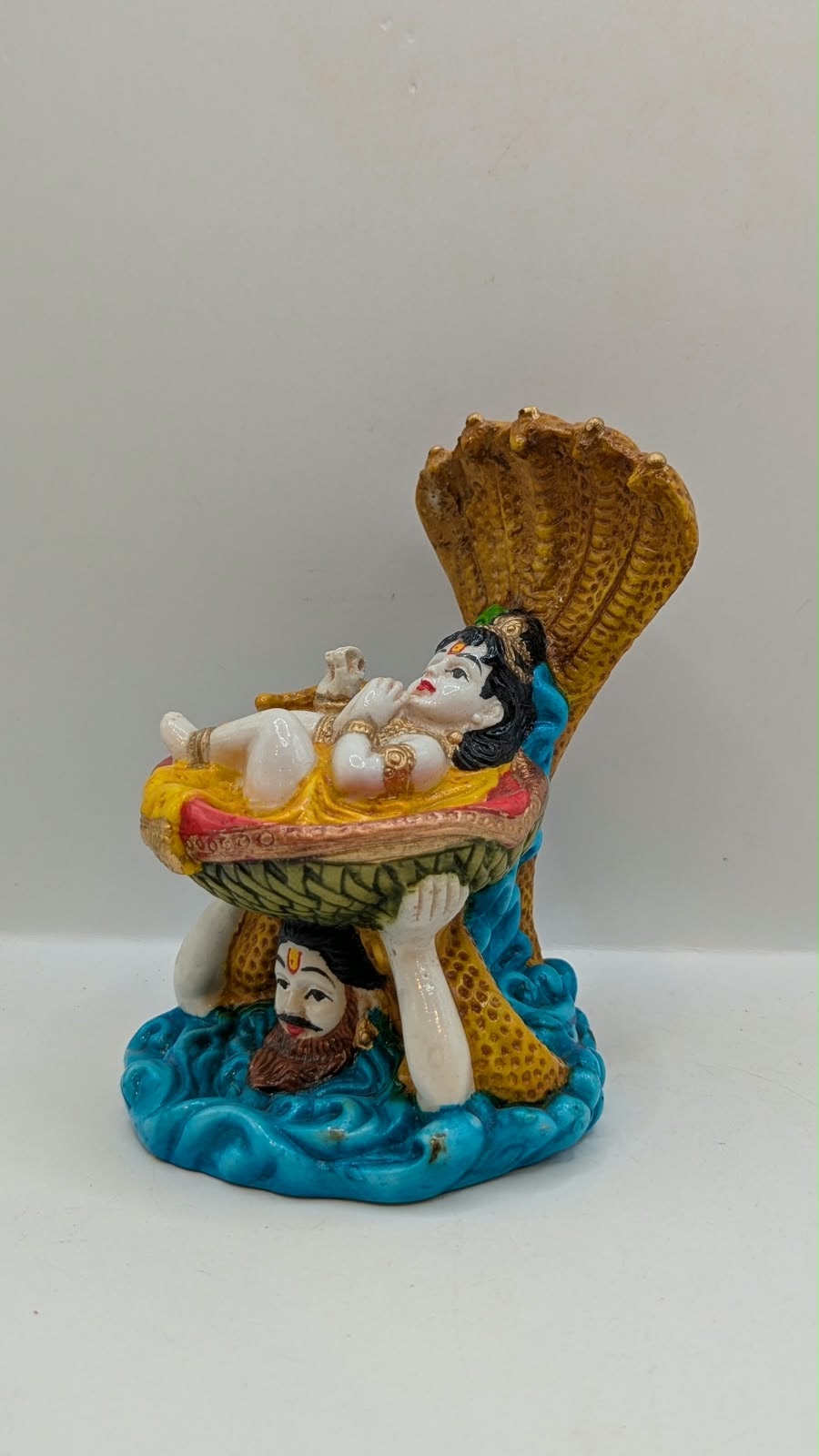 Vasudev carrying baby Krishna statue, other side view