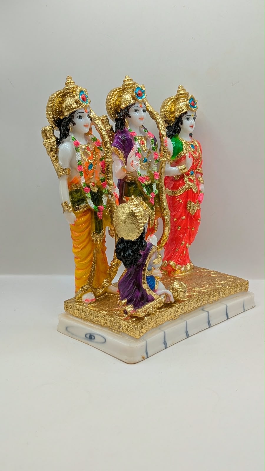 Colourful Ram Darbar statue with gold base, front view
