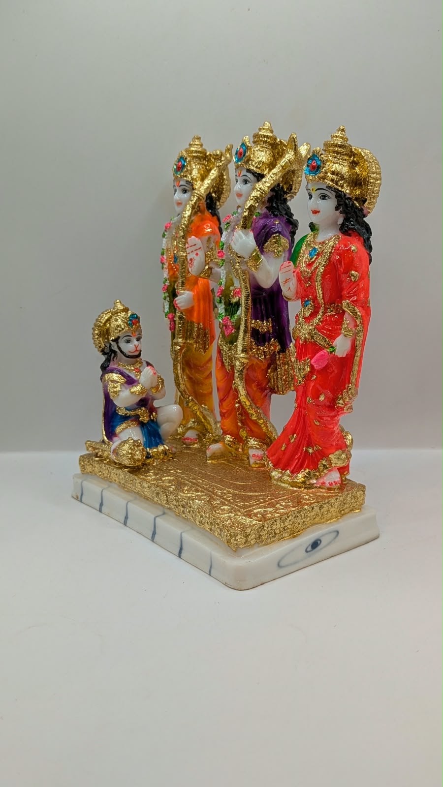 Colourful Ram Darbar statue with gold base, other side view