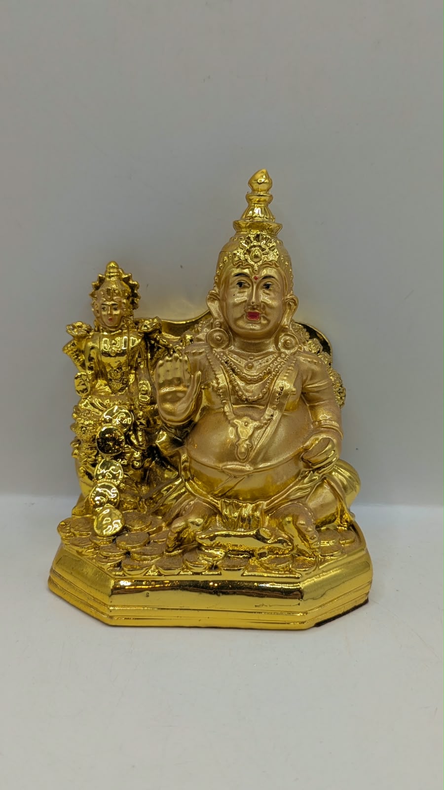 Gold Kuber statue, front view