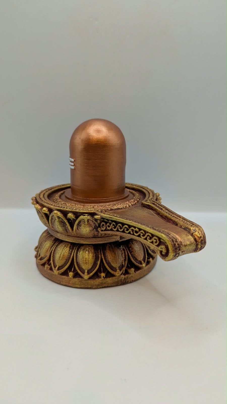 Copper and gold Shivling statue, other side view