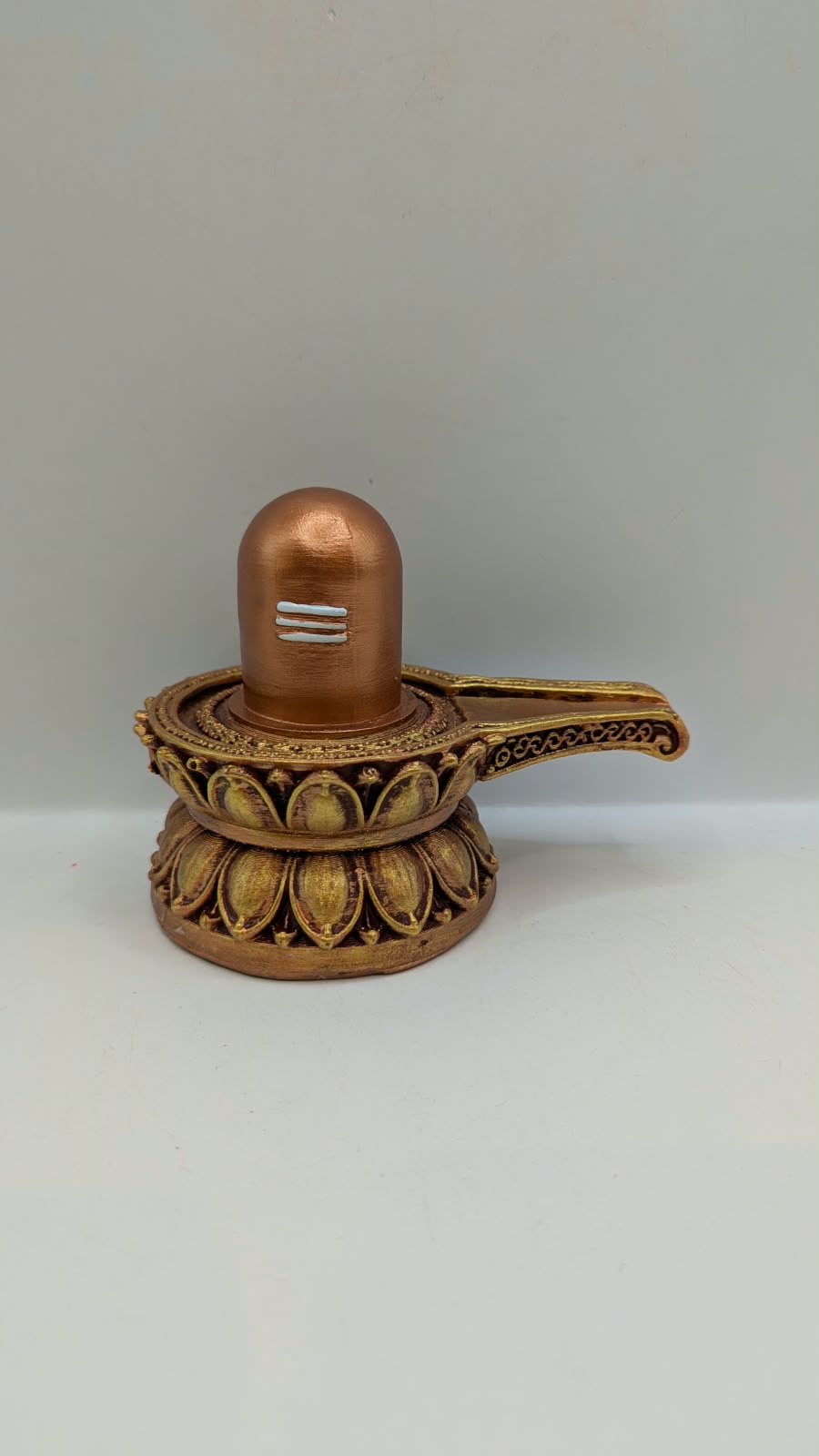 Small copper and gold Shivling statue, front view