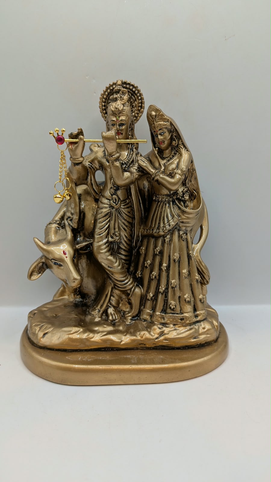 Antique gold Radha Krishna with cow statue, front view