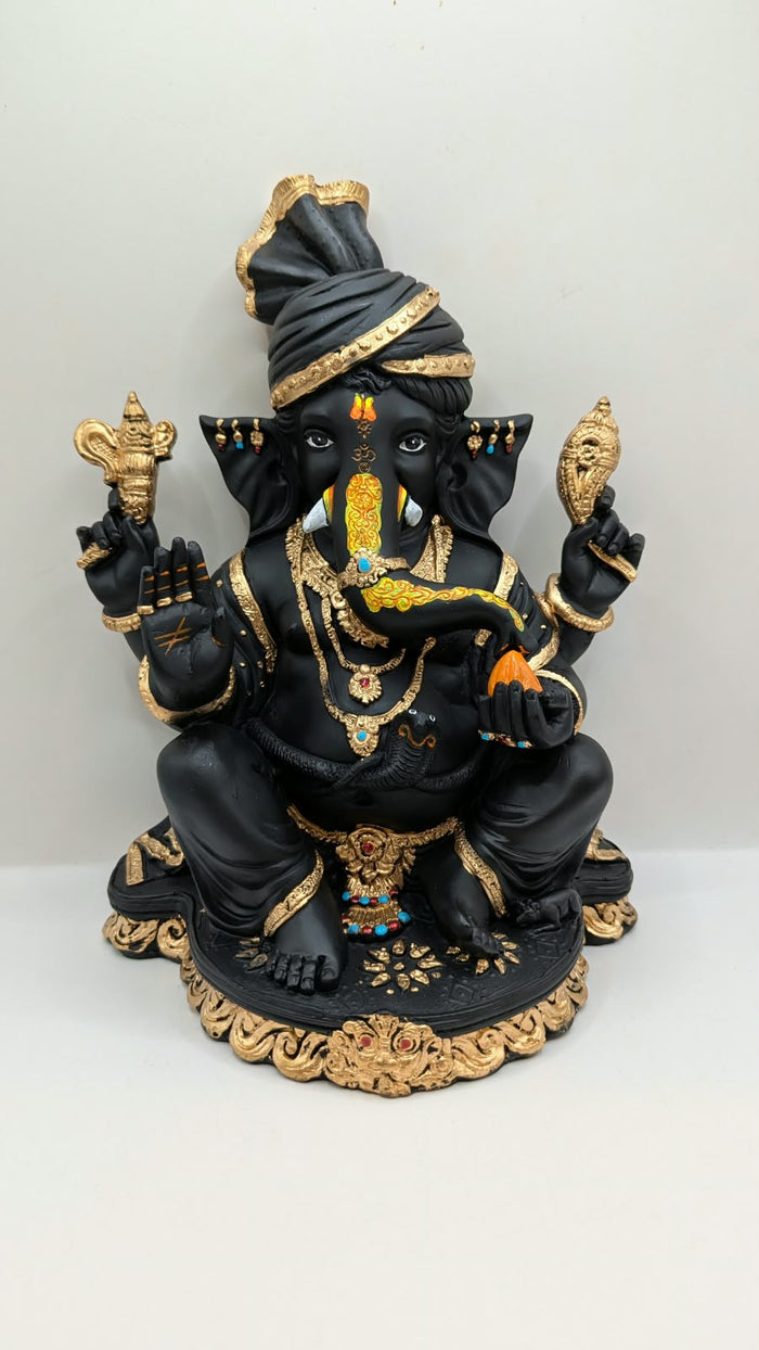 Black and gold Ganesh statue with turban, front view