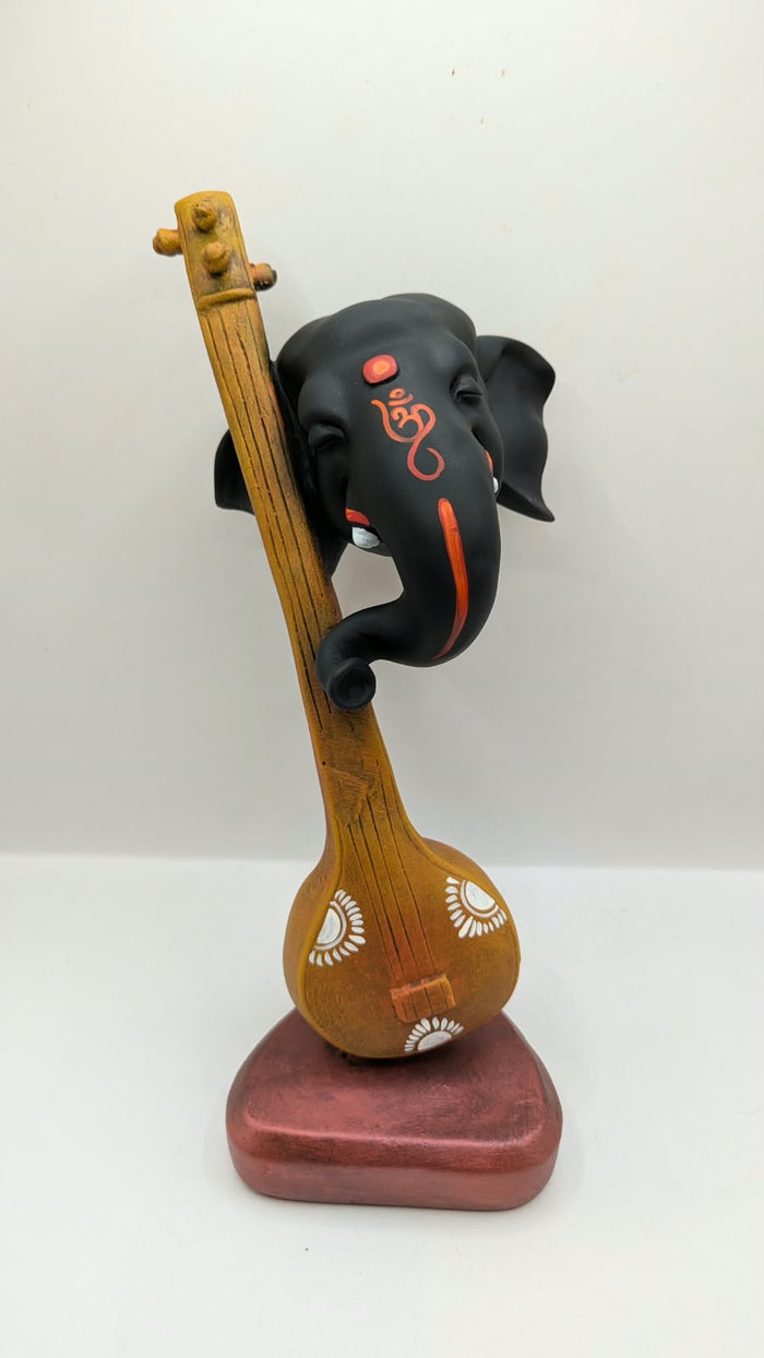 Ganesh head on veena statue, front view