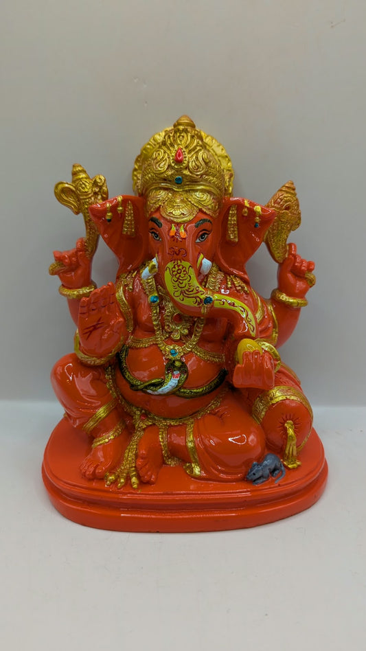Orange and gold Ganesh statue, front view