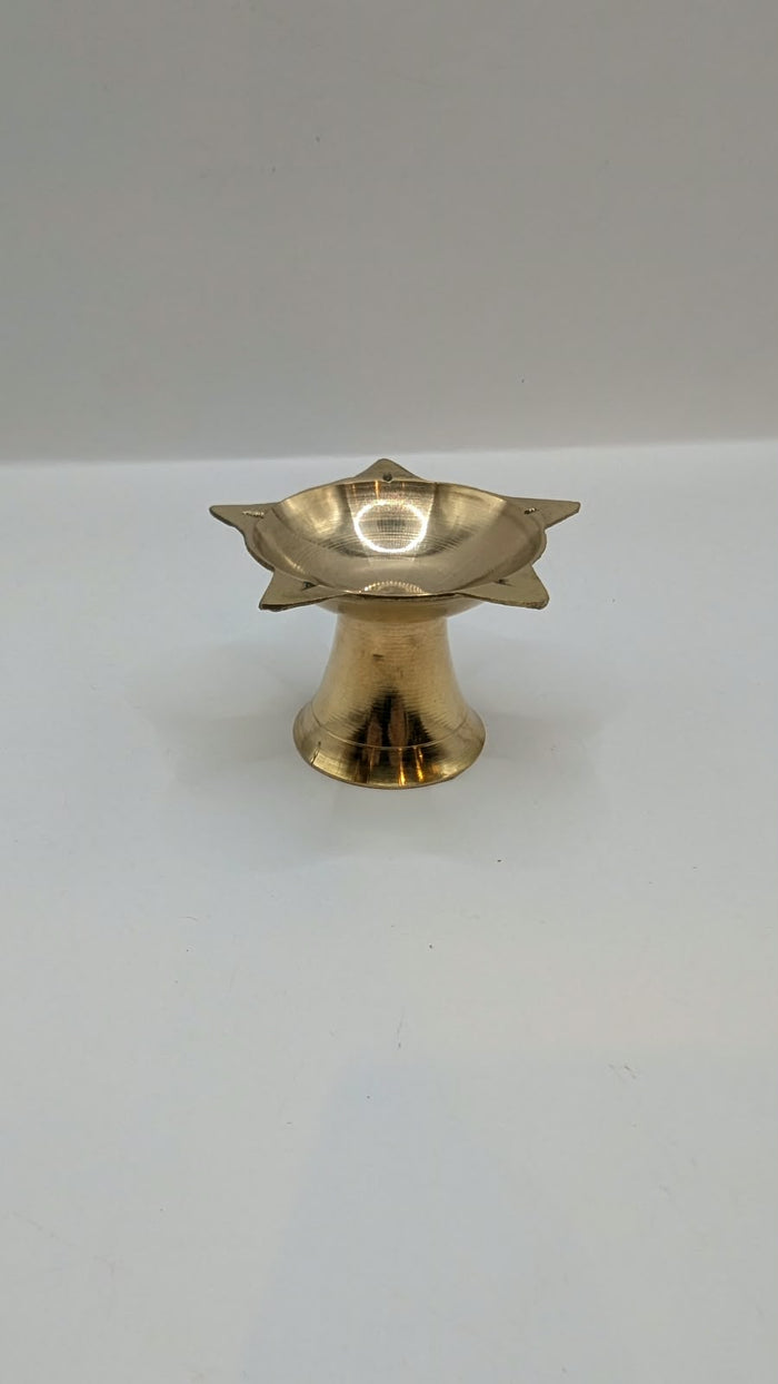 Metal star diya on stand, front view
