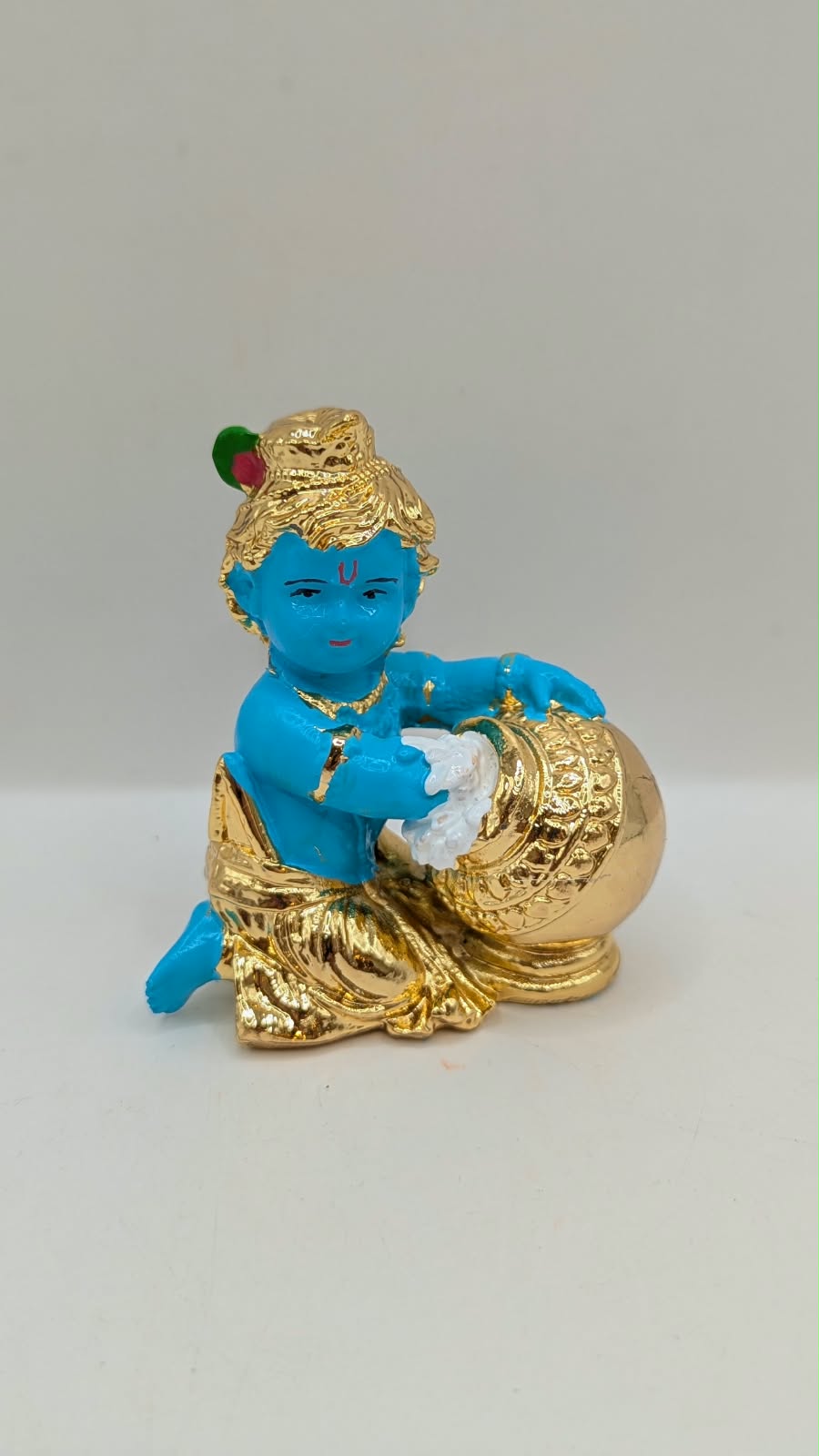 Blue and gold Baby Krishna murti with butter pot, front view