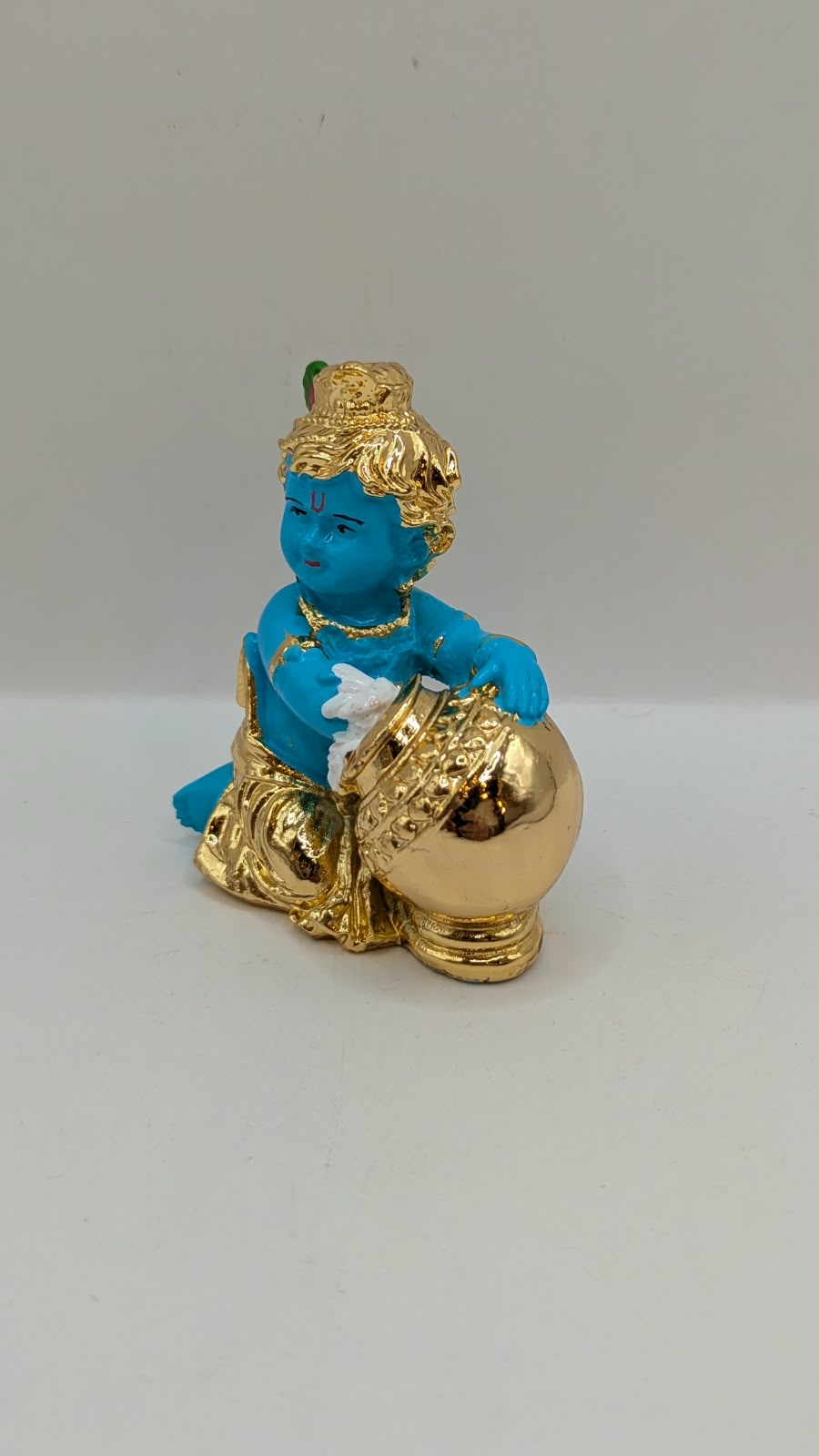 Blue and gold Baby Krishna murti with butter pot, other side view