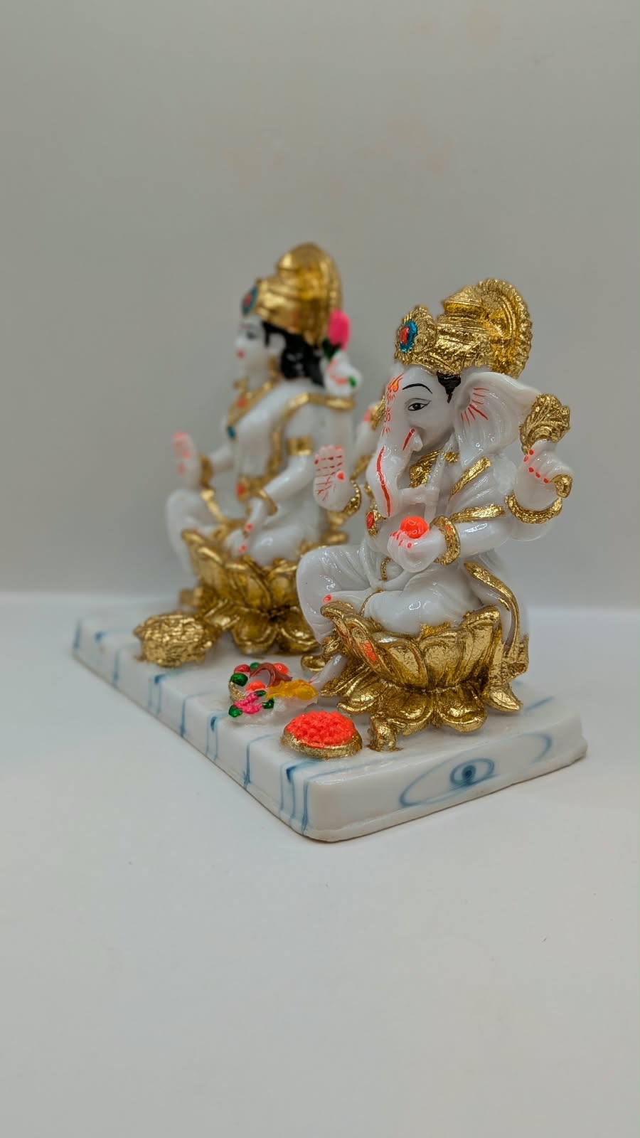 White and gold Laxmi Ganesh statue, other side view
