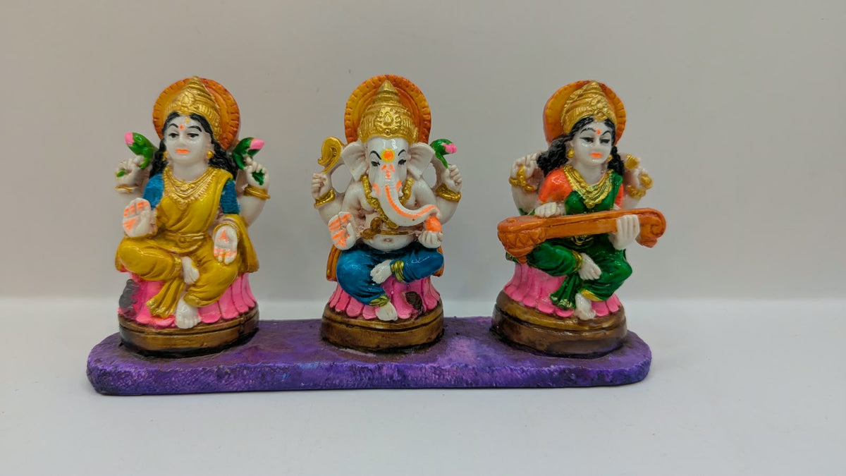 Colourful Laxmi Ganesh Saraswati statue set, front view