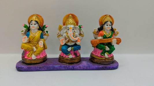 Colourful Laxmi Ganesh Saraswati statue set, front view