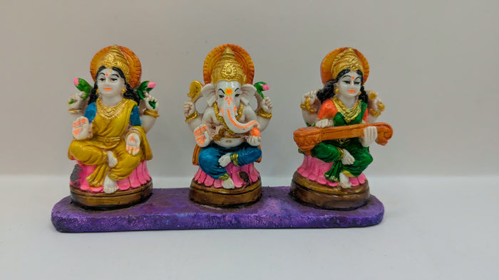 Colourful Laxmi Ganesh Saraswati statue set, front view