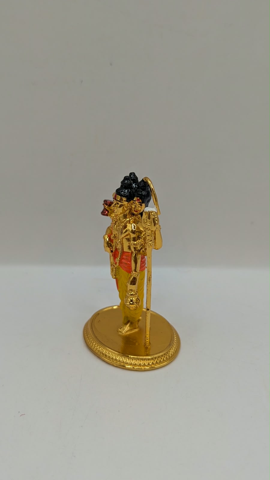 Gold Dattatreya murti, other side view
