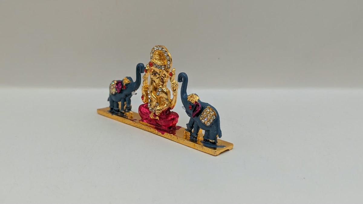 Gold Ganesh murti with two elephants, other side view