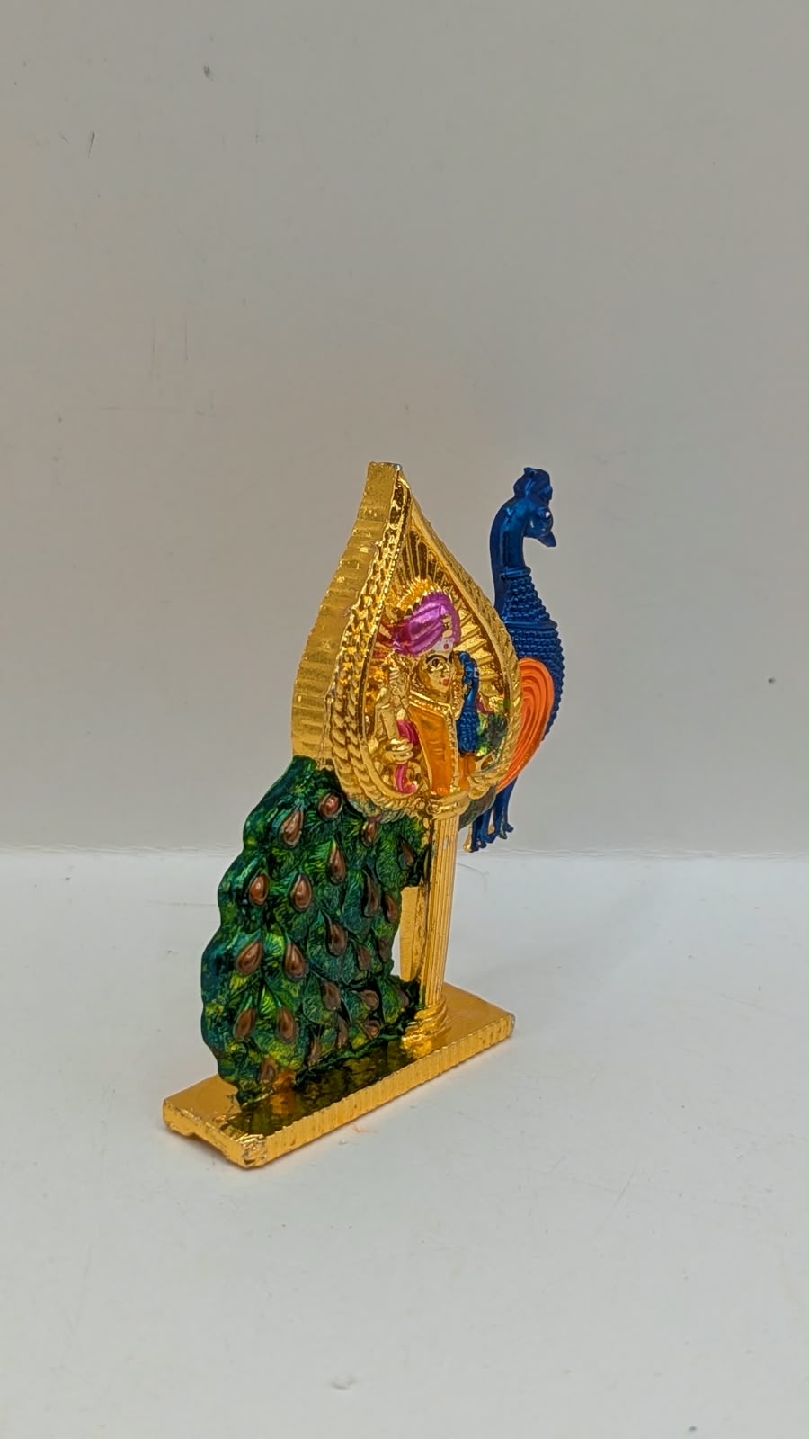 Gold Murugan Vel with peacock, side view