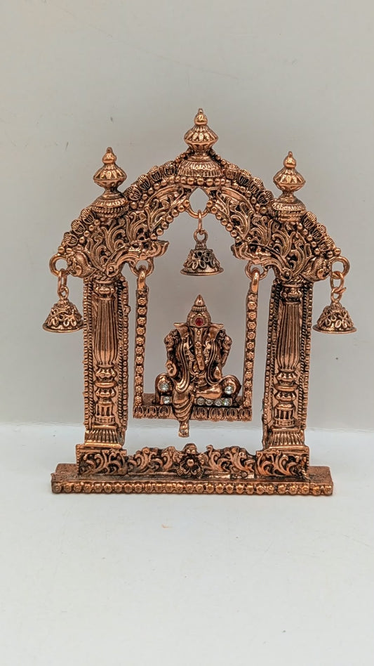 Copper Ganesh jhula murti in temple arch, front view