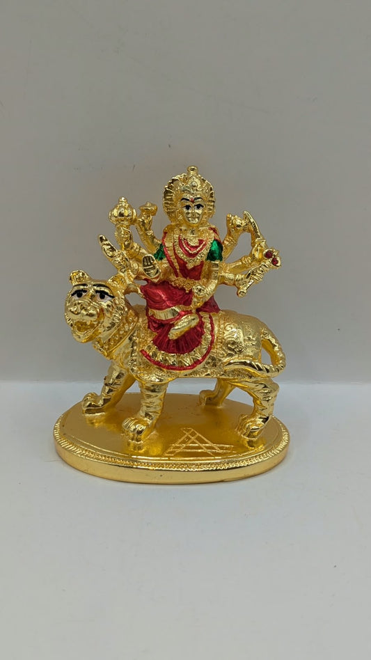 Gold Durga Mata murti with red saree on lion, front view