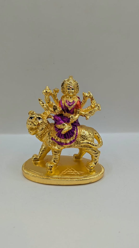 Gold Durga Mata murti with purple saree on lion, front view