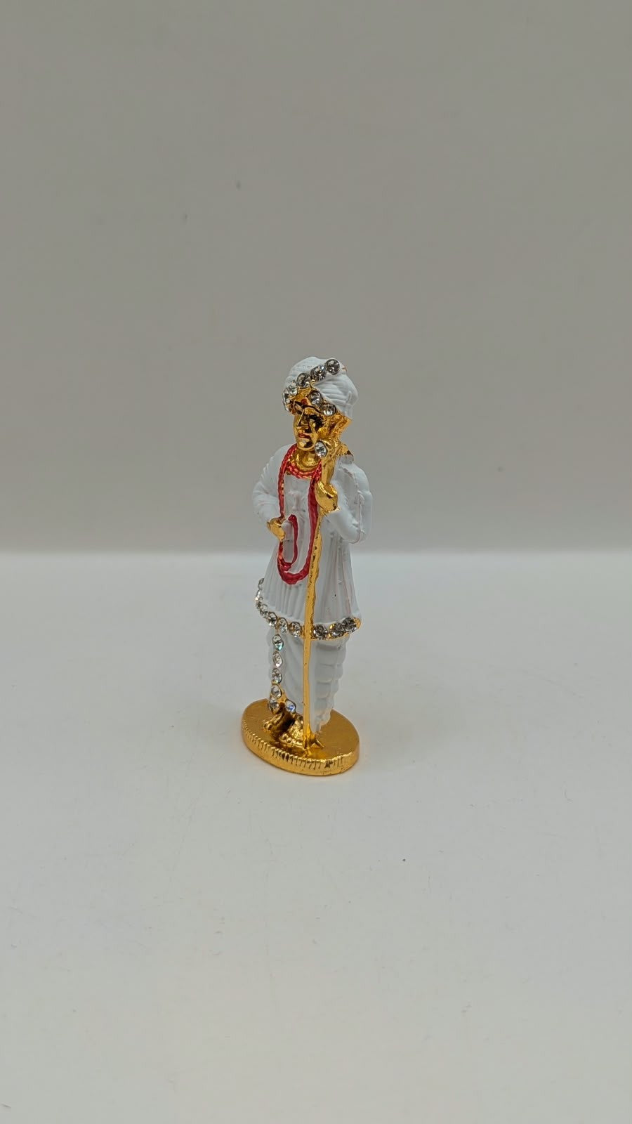 White and gold Jalaram Bapa murti, other side view
