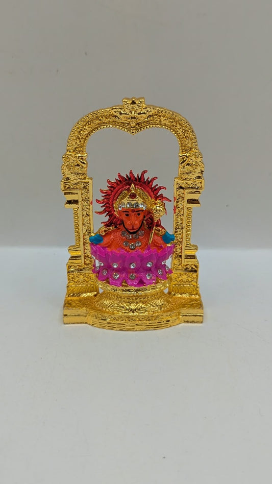 Gold Hanuman murti in temple arch on pink lotus, front view