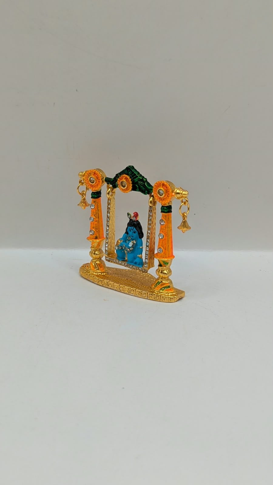Bal Gopal on gold and orange jhula murti, other side view