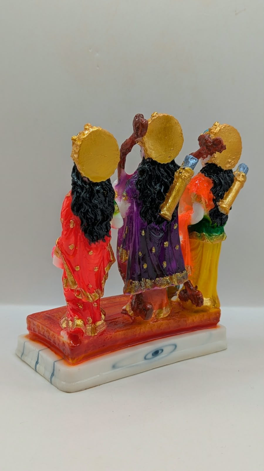 Colourful Ram Darbar resin statue on orange base, back view