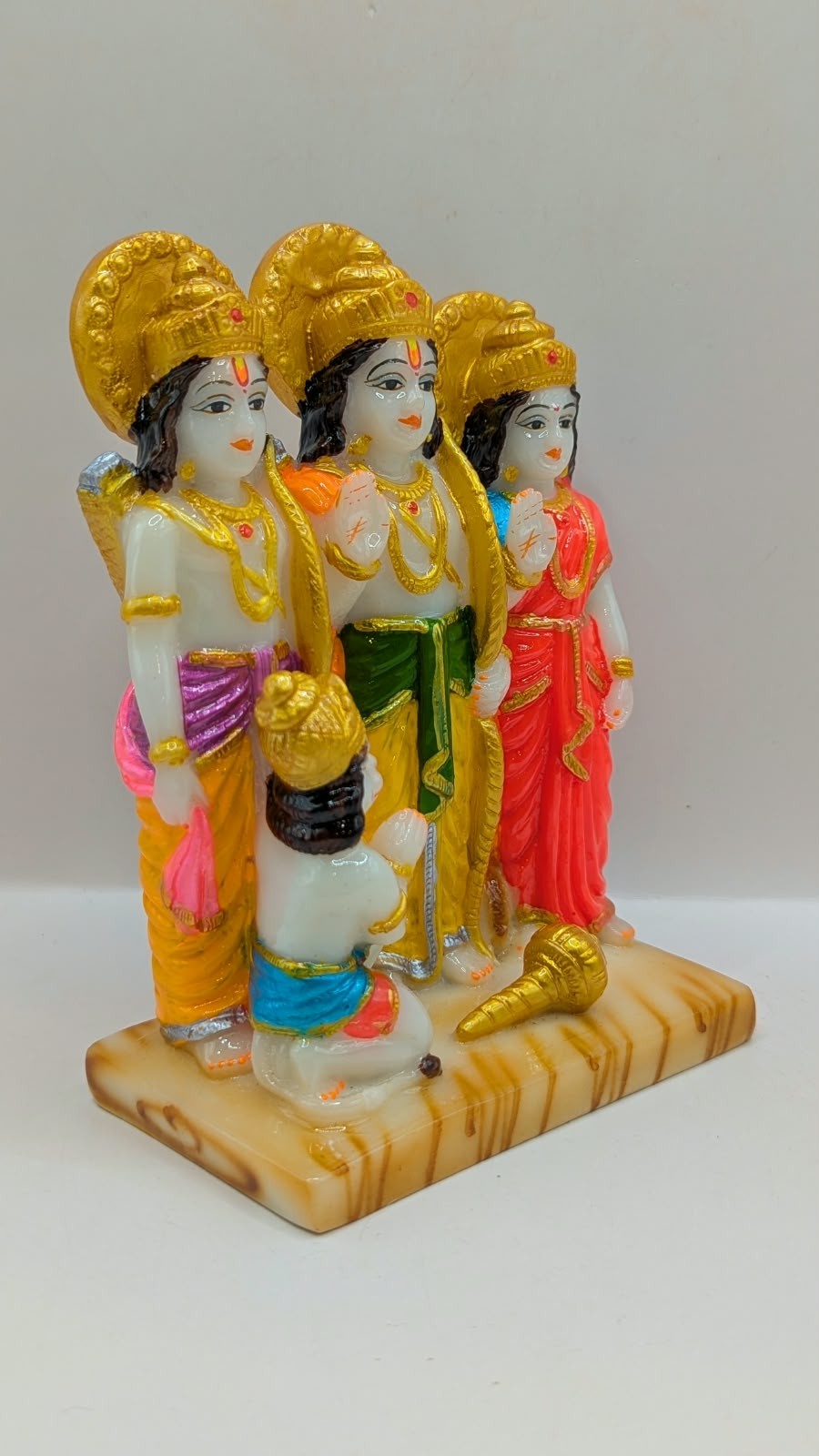 White and gold Ram Darbar resin statue, side view