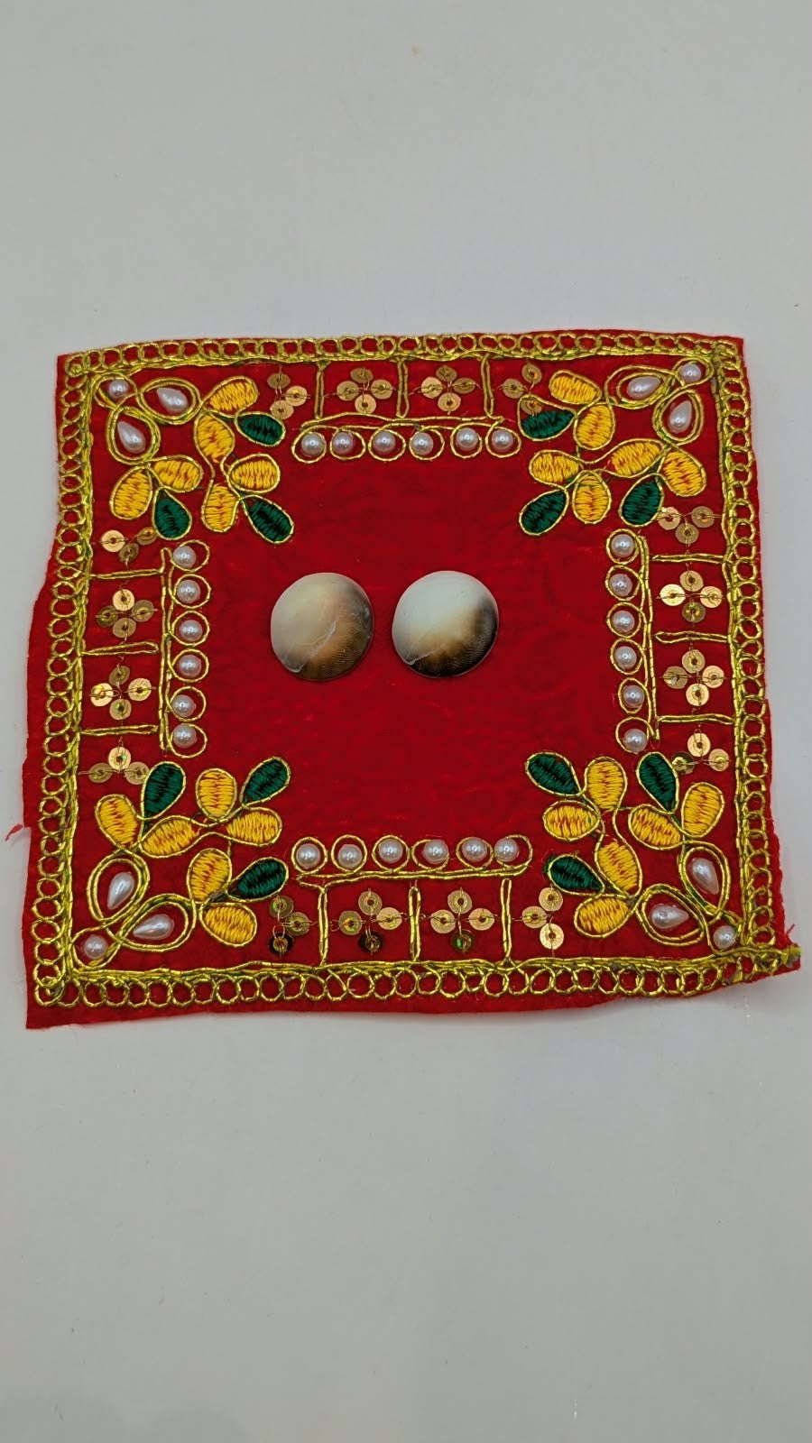 Two Gomti Chakra shells, other view