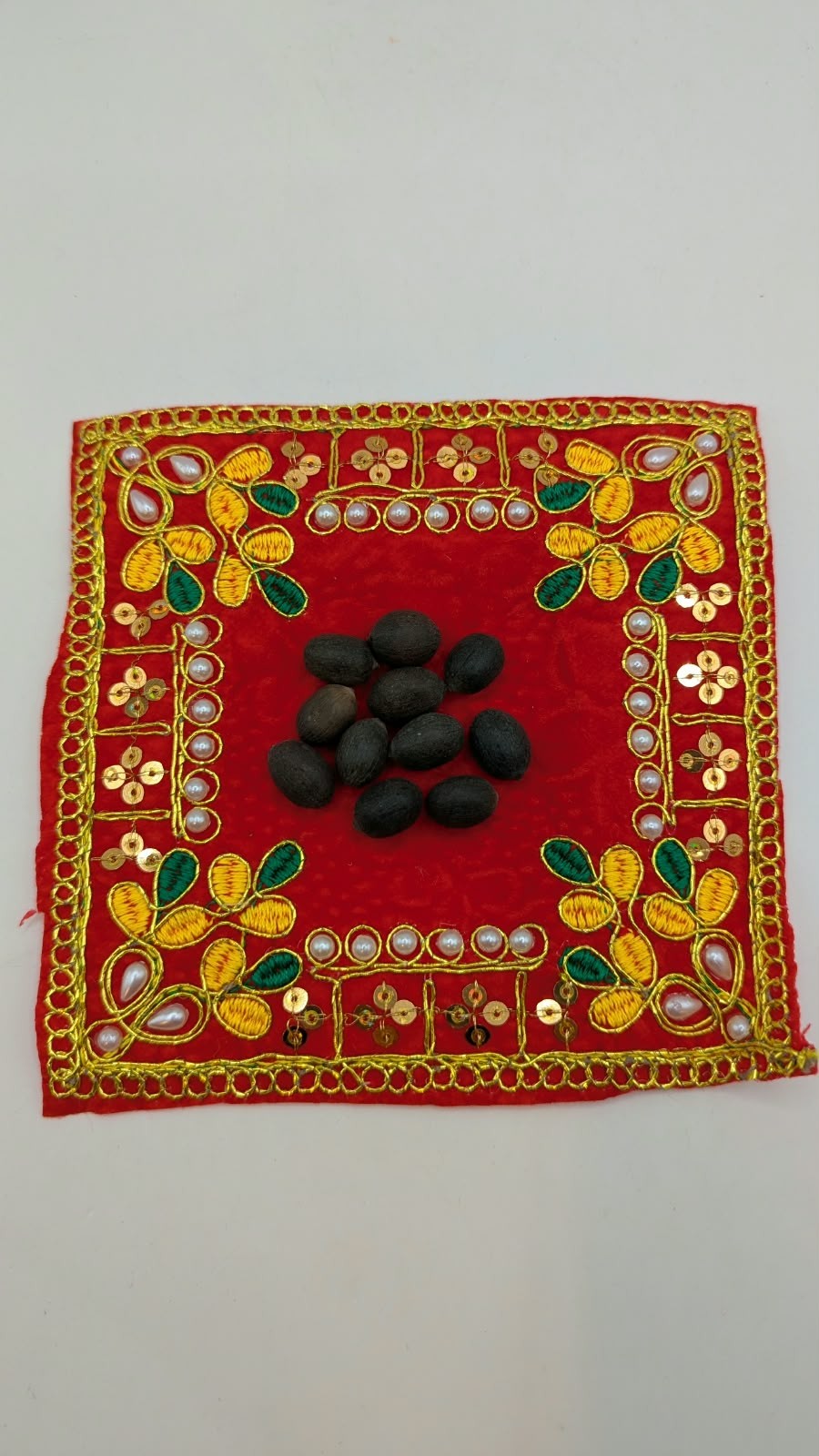 Kamar Kakadi lotus seeds on red cloth