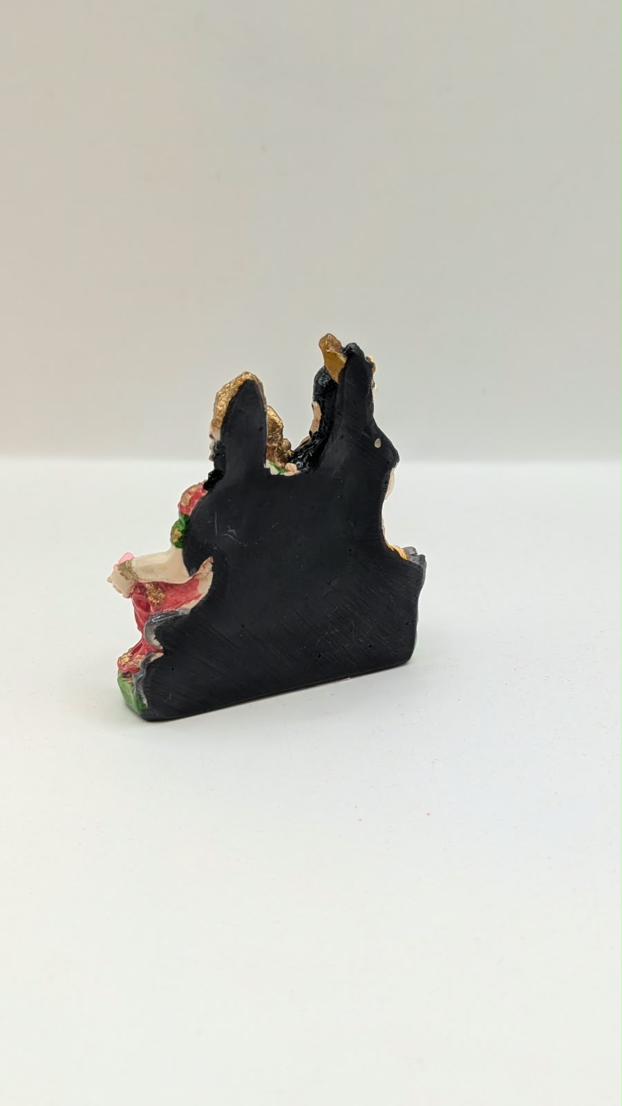 Colourful Shiv Parivar resin statue on green base, back view