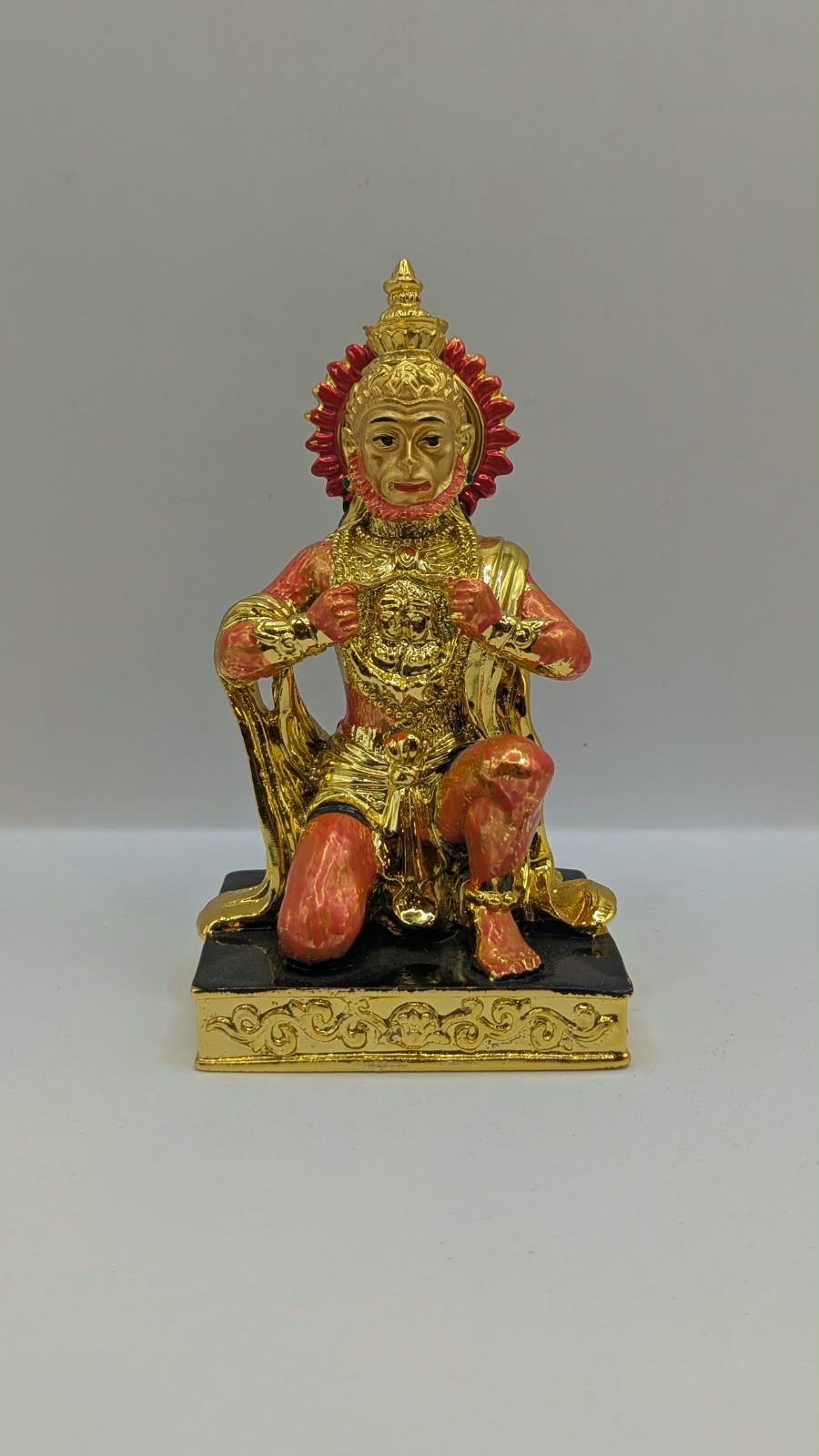 Gold and orange kneeling Hanuman resin statue, front view