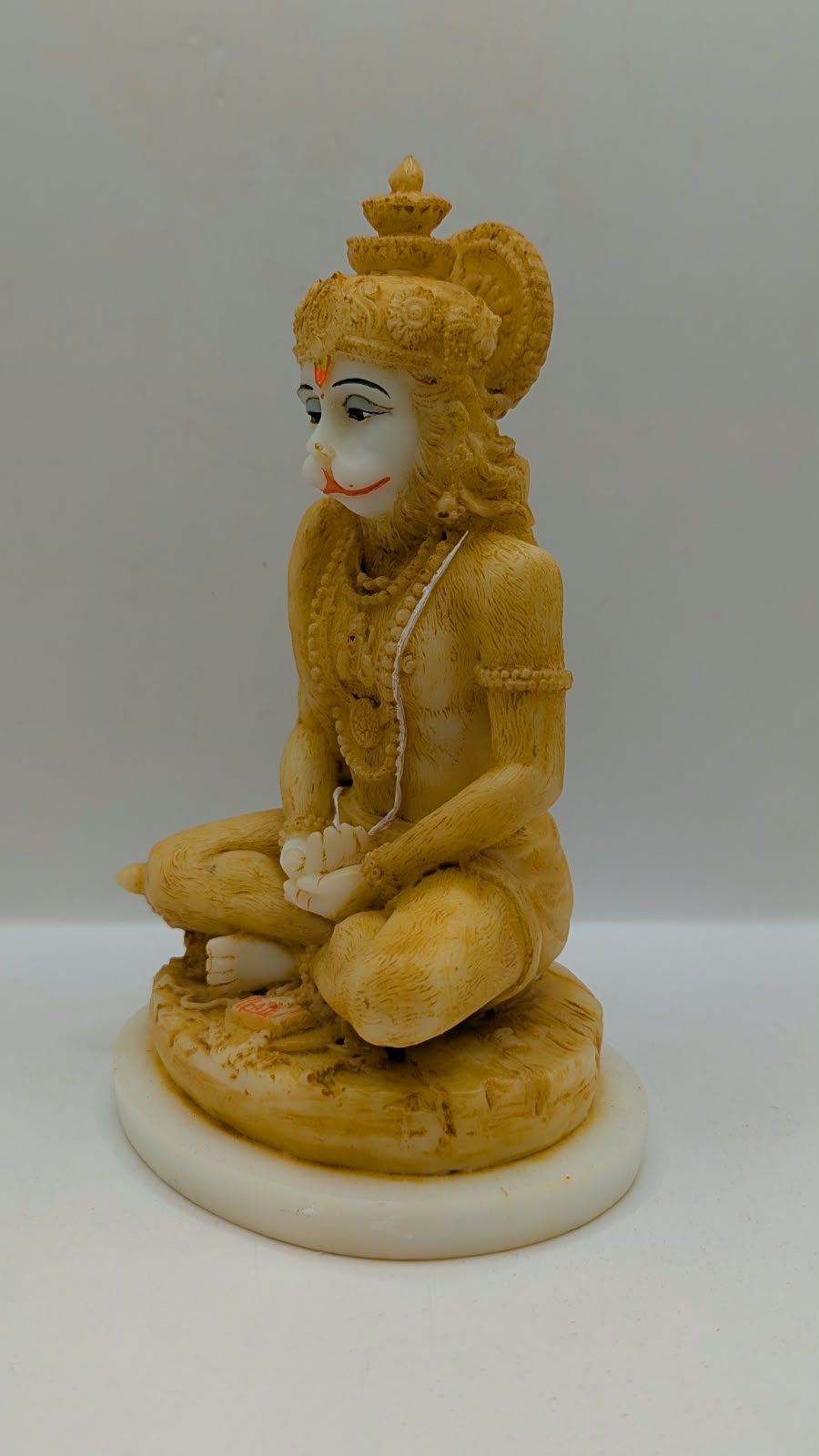 Cream meditating Hanuman resin statue, other side view