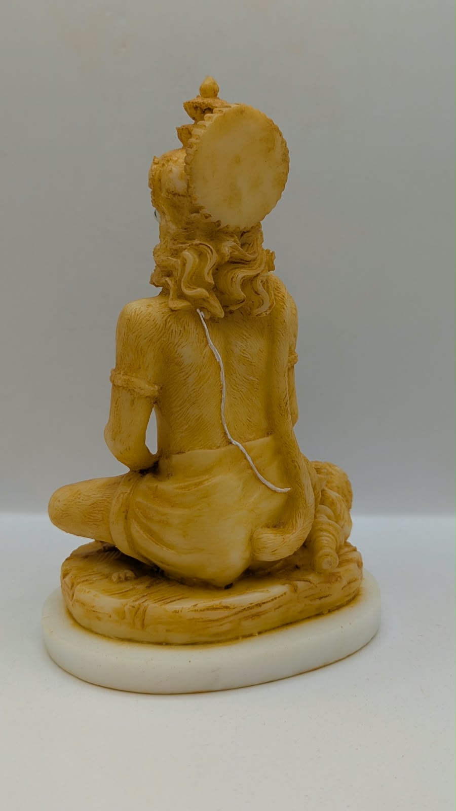 Cream meditating Hanuman resin statue, back view