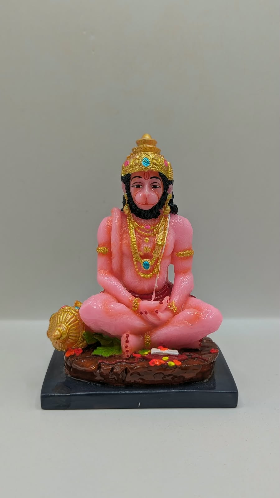 Pink meditating Hanuman resin statue, front view