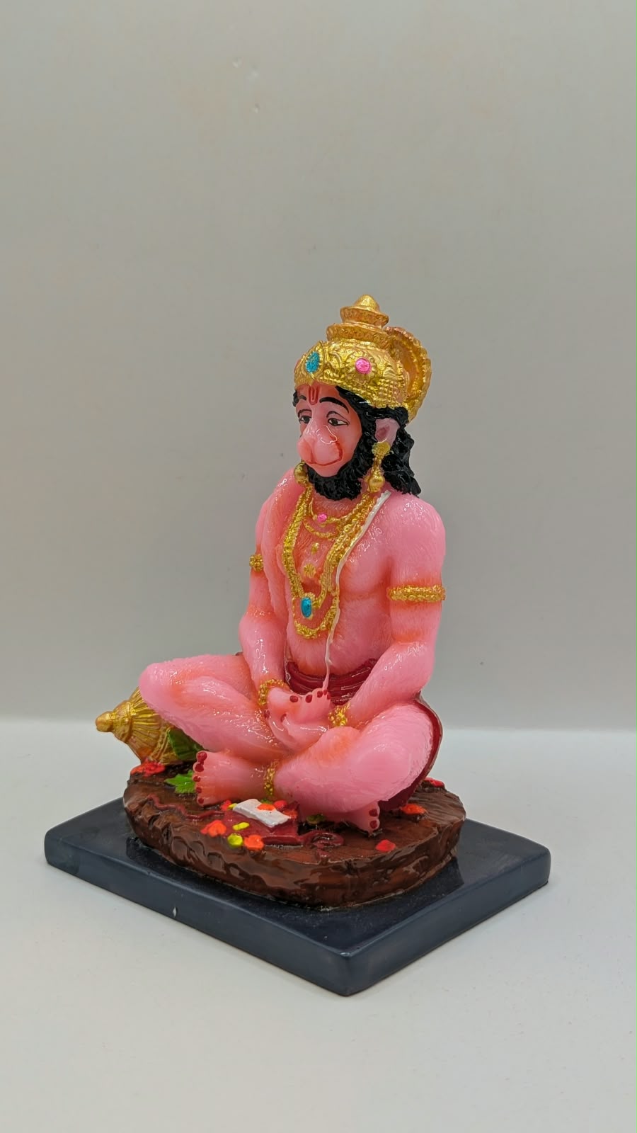 Pink meditating Hanuman resin statue, other side view