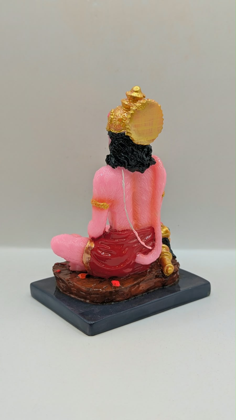 Pink meditating Hanuman resin statue, back view