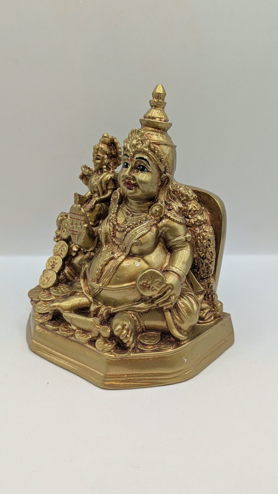 Gold Kuber statue with Laxmi, other side view