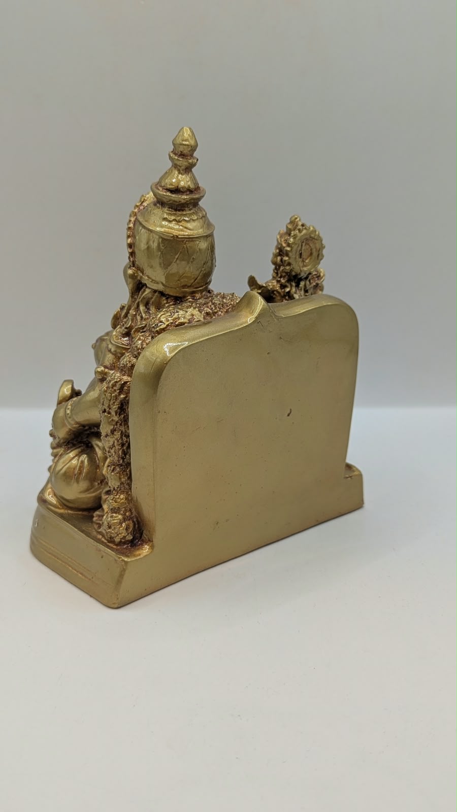 Gold Kuber statue with Laxmi, back view