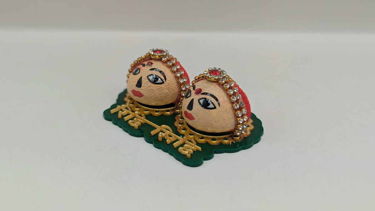Riddhi Siddhi faces on green base, other side view