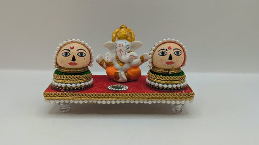 Ganesh Riddhi Siddhi set on red chowki, front view