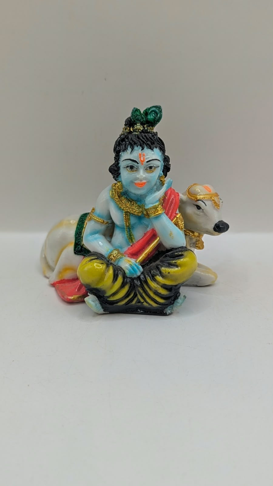 Krishna with cow statue, front view