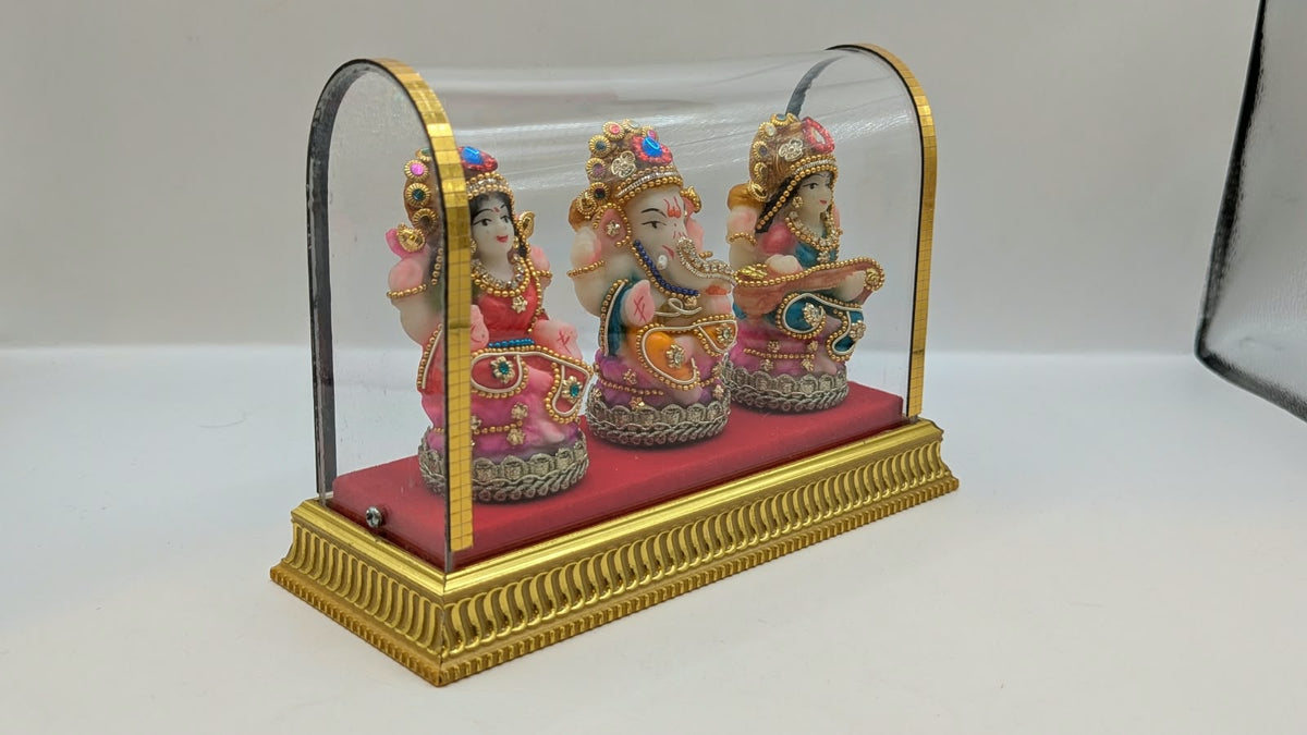Lakshmi Ganesh Saraswati set in clear case, side view
