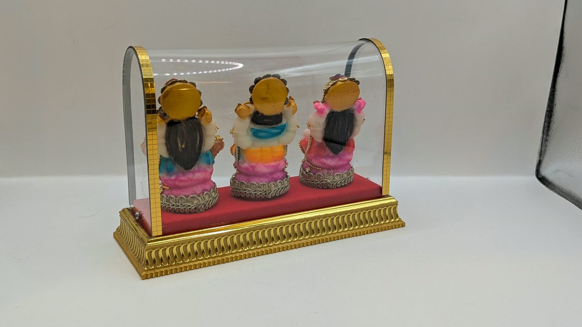 Lakshmi Ganesh Saraswati set in clear case, back view