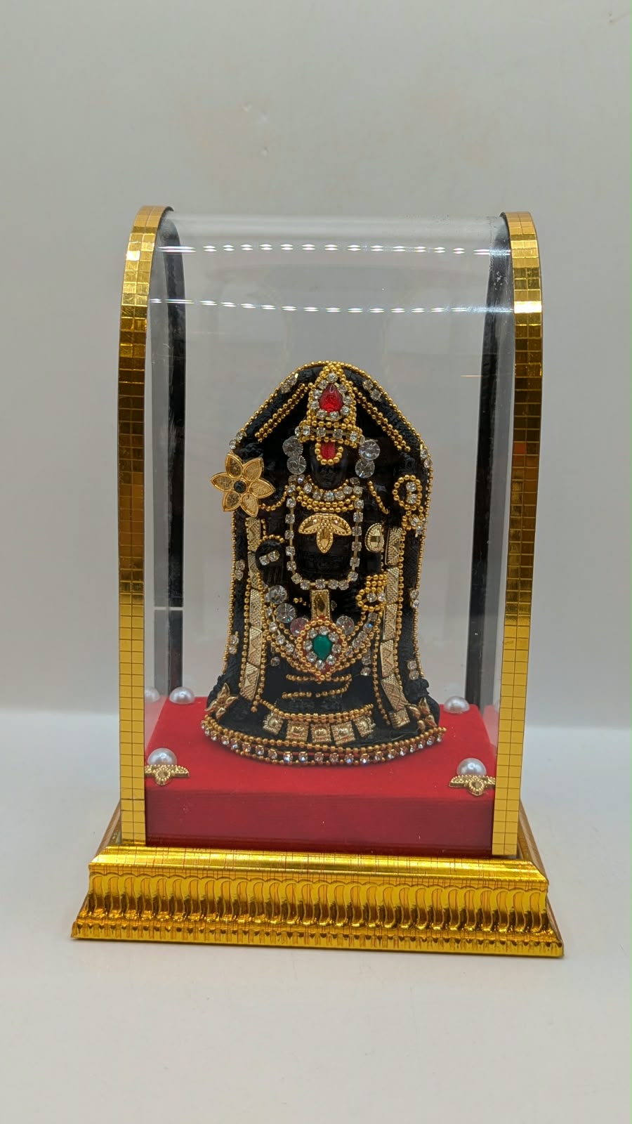 Tirupati Balaji murti in clear case, front view