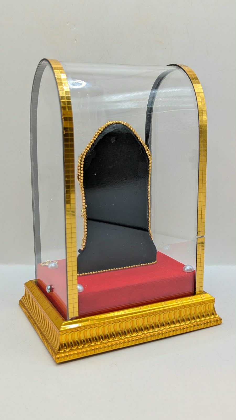 Tirupati Balaji murti in clear case, back view