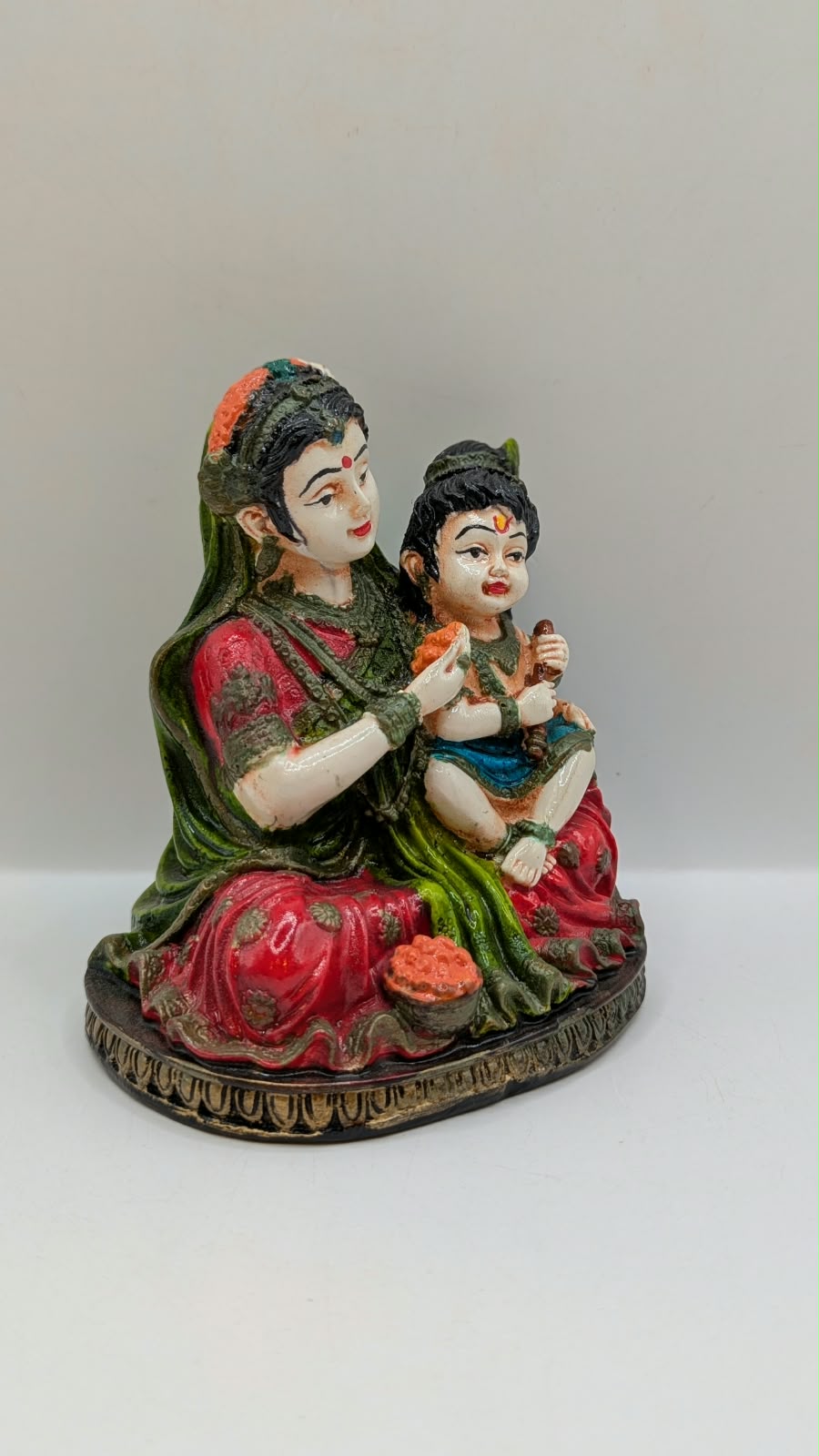 Colourful Yashoda Krishna statue, side view