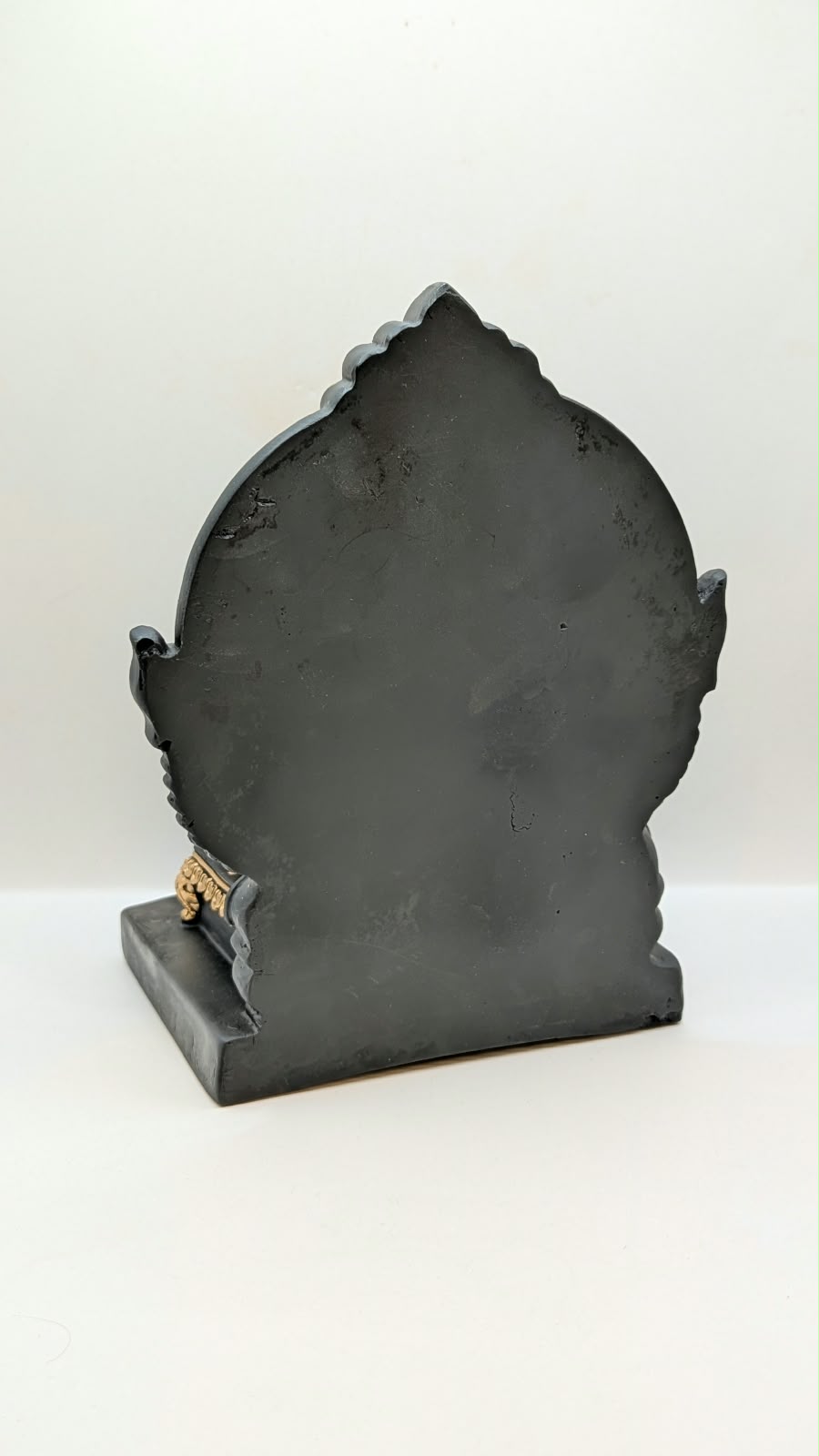 Black and gold Ganesh on throne, back view