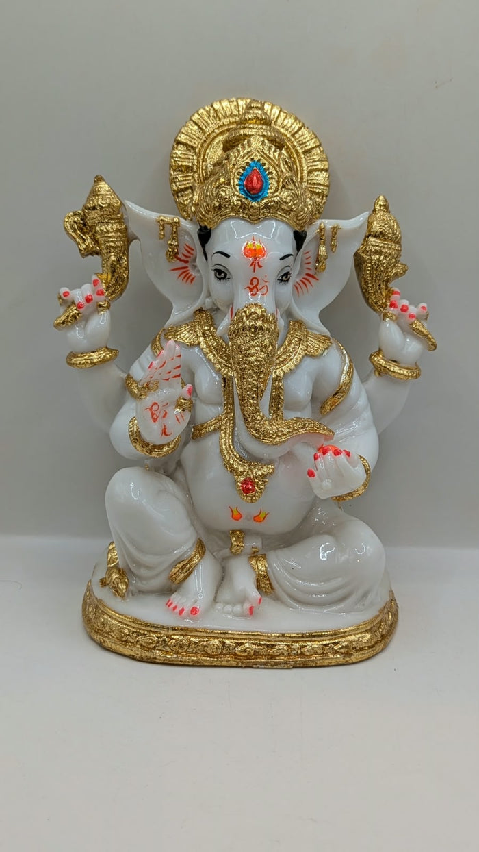 White and gold Ganesh statue, front view